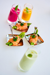 Image showing Appetizer plate of sauteed asparagus wrapped in thin slices smoked salmon