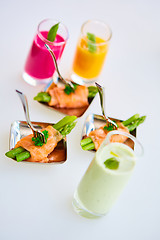 Image showing Appetizer plate of sauteed asparagus wrapped in thin slices smoked salmon