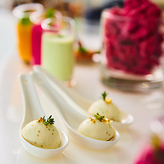 Image showing Appetizer pike caviar decorated with gold and green.