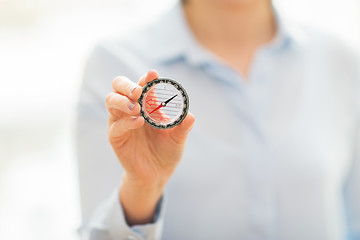 Image showing close up of woman hand holding compass