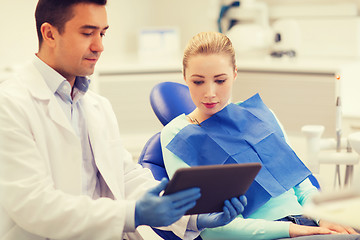 Image showing male dentist with tablet pc and woman patient