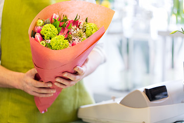 Image showing close up of florist with bunch at flower shop