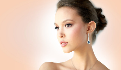 Image showing close up of beautiful woman face with earring