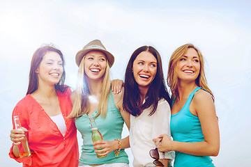 Image showing girls with drinks on the beach