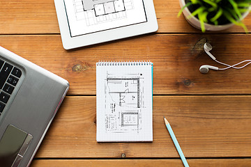 Image showing close up of notebook, laptop and tablet pc on wood