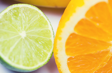 Image showing close up of fresh juicy orange and lime