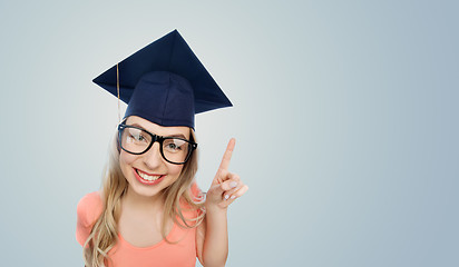 Image showing smiling young student woman in mortarboard