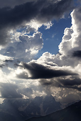 Image showing High mountains before rain and sunlight clouds