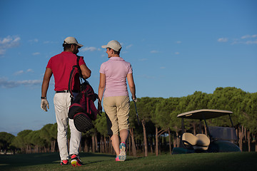 Image showing couple walking on golf course