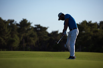 Image showing golfer hitting long shot