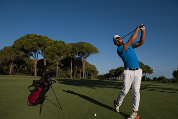 Image showing golf player hitting shot