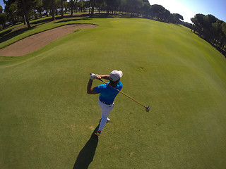 Image showing top view of golf player hitting shot