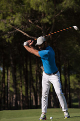 Image showing golf player hitting shot