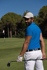 Image showing golf player portrait from back