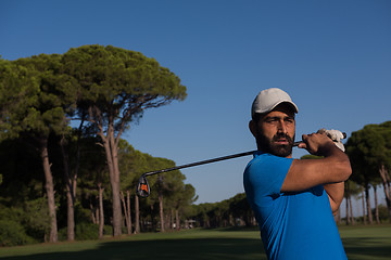 Image showing golf player hitting shot