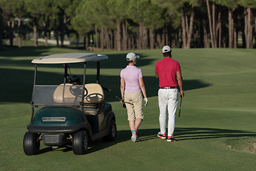 Image showing couple walking on golf course