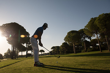 Image showing golf player hitting shot