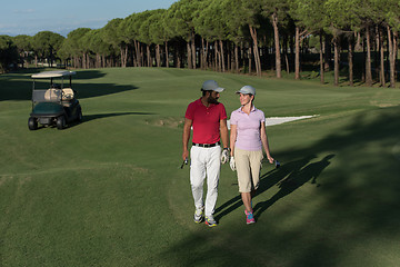 Image showing couple walking on golf course