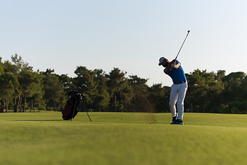 Image showing golfer hitting long shot