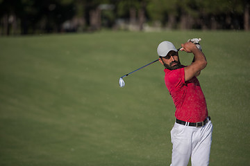 Image showing golfer hitting a sand bunker shot