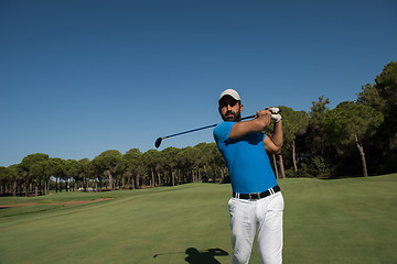 Image showing golf player hitting shot