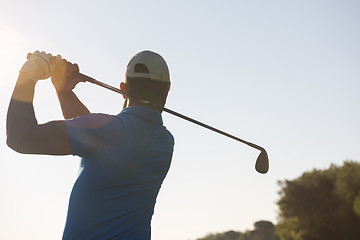 Image showing golf player hitting shot