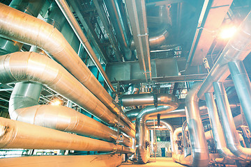 Image showing Equipment, cables and piping as found inside of a modern industr