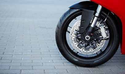 Image showing Front motorcycle disk breaks and tire in close up