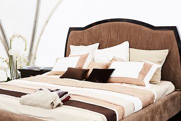 Image showing Interior of a bedroom in brown tones.