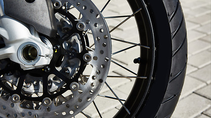 Image showing Front motorcycle disk breaks and tire in close up