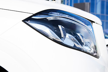 Image showing Closeup headlights of luxury car.