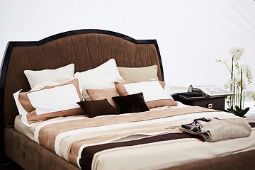 Image showing Interior of a bedroom in brown tones.