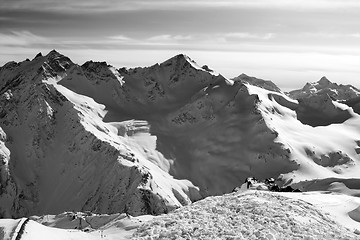 Image showing Black and white Snowy off-piste slopes at evening