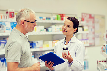 Image showing pharmacist with tablet pc and senior man