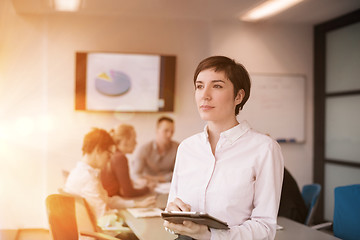 Image showing business woman on meeting  using tablet computer