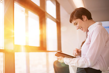 Image showing business woman on meeting  using tablet computer