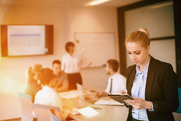 Image showing business woman on meeting  using tablet computer