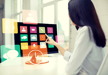 Image showing close up of woman with apps on computer in office