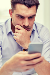 Image showing close up of businessman with smartphone