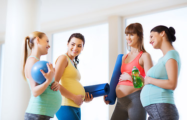Image showing group of happy pregnant women talking in gym