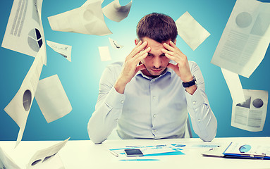 Image showing close up of businessman with smartphone and papers