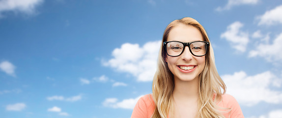 Image showing happy young woman or teenage girl in eyeglasses