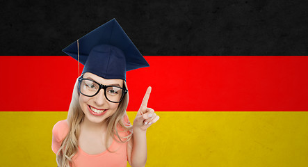 Image showing smiling young student woman in mortarboard