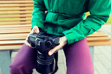 Image showing close up of male photographer with digital camera