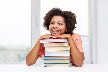 Image showing happy african student girl with books at home