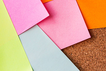 Image showing close up of blank paper stickers on cork board