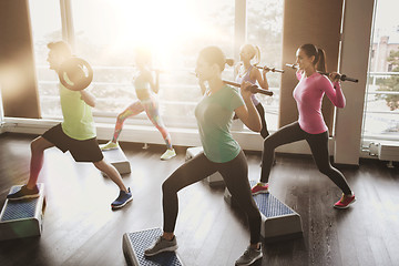 Image showing group of people exercising with barbell in gym