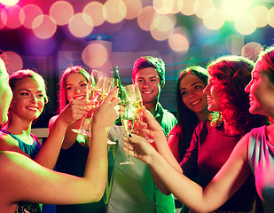 Image showing smiling friends with wine glasses and beer in club