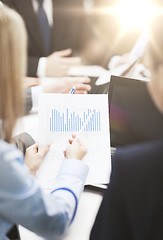 Image showing close up of chats, laptop and graphs in office