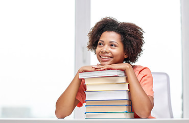 Image showing happy african student girl with books at home